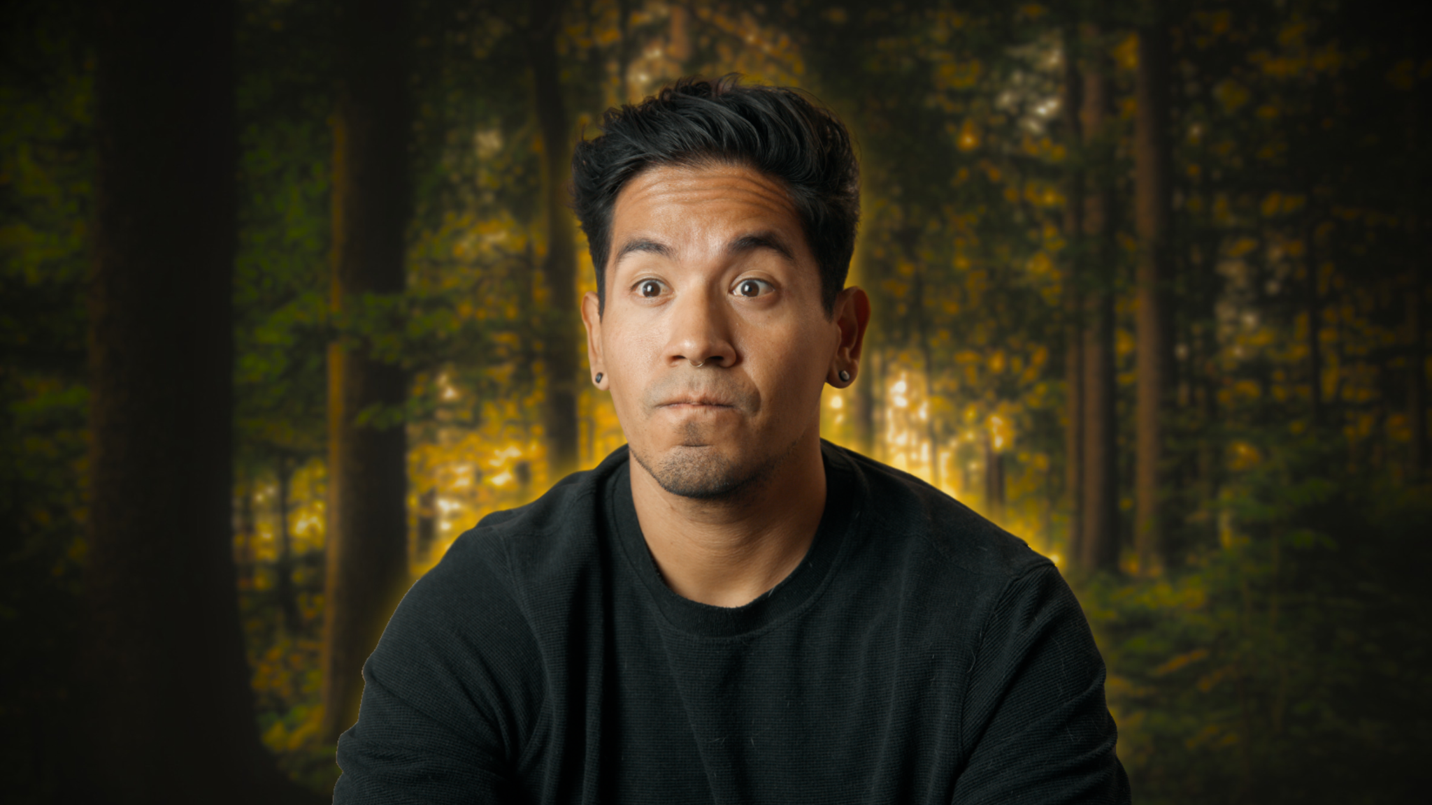 Edgar looking bemused against a forest background